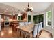 Eat-in kitchen with dining table and chairs, slider patio door and view of the backyard at 11056 W Rowland Ave, Littleton, CO 80127
