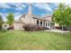 Beautiful home exterior featuring a well-maintained lawn and charming patio at 11056 W Rowland Ave, Littleton, CO 80127