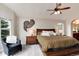 Serene primary bedroom suite with high ceilings, comfortable bedding, and relaxing decor at 11056 W Rowland Ave, Littleton, CO 80127
