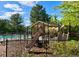 Playground with slides and climbing equipment next to a pool and picnic area for Gathering recreation and enjoyment at 11056 W Rowland Ave, Littleton, CO 80127