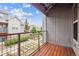 Enjoy this balcony view with wood floors, metal siding and metal wire rail overlooking manicured grounds at 85 Uinta Way # 405, Denver, CO 80230