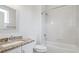 Bathroom with tile shower and granite countertop at 85 Uinta Way # 405, Denver, CO 80230