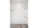 Walk-in closet with carpet and rods for hanging clothing at 85 Uinta Way # 405, Denver, CO 80230