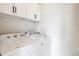 Laundry room featuring a washer and dryer at 85 Uinta Way # 405, Denver, CO 80230