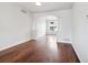 Elegant living room with hardwood floors, arched doorway, and lots of natural light at 85 Uinta Way # 405, Denver, CO 80230