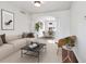 Bright living room with neutral tones, featuring a dining area and stylish decor for comfortable living at 85 Uinta Way # 405, Denver, CO 80230