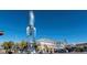 View of a rocket sculpture outside of a shopping area. Airplane visible in background at 85 Uinta Way # 405, Denver, CO 80230