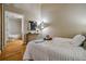 Comfortable bedroom with hardwood floors and a view of the bathroom at 1745 Wazee St # 4G, Denver, CO 80202