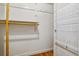 Walk-in closet with shelving and hanging rods for organized storage in this condo at 1745 Wazee St # 4G, Denver, CO 80202