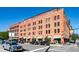 Charming brick building exterior with retail space and a rooftop garden, perfect for urban living at 1745 Wazee St # 4G, Denver, CO 80202