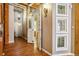 Hallway with exposed wood beams, decorative windows, and hardwood floors at 1745 Wazee St # 4G, Denver, CO 80202