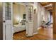 Hallway featuring decorative stained-glass doors opening into a bedroom at 1745 Wazee St # 4G, Denver, CO 80202