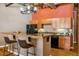 Stylish kitchen with granite countertops, stainless steel appliances, and a breakfast bar with seating at 1745 Wazee St # 4G, Denver, CO 80202