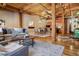 Spacious living room with exposed wood beams, hardwood floors, and an open floor plan to the kitchen at 1745 Wazee St # 4G, Denver, CO 80202