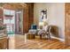 Cozy sitting area with exposed brick wall, hardwood floors, and stylish decor at 1745 Wazee St # 4G, Denver, CO 80202