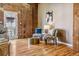 Cozy sitting area with exposed brick wall, hardwood floors, and stylish decor at 1745 Wazee St # 4G, Denver, CO 80202