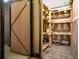 Secured, caged storage unit with shelving for storing personal items in the condo at 1745 Wazee St # 4G, Denver, CO 80202