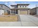 Modern two-story home with a two-car garage and neutral toned color palette at 24769 E 39Th Ave, Aurora, CO 80019