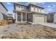 Stylish two-story home with a cozy front porch and a two-car garage at 24769 E 39Th Ave, Aurora, CO 80019