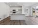 Bright kitchen boasts an island, modern appliances, and ample cabinet space, perfect for cooking and entertaining at 24769 E 39Th Ave, Aurora, CO 80019