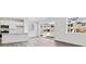 Modern kitchen with a central island, state-of-the-art appliances, and seamless access to outdoor views and natural light at 24769 E 39Th Ave, Aurora, CO 80019