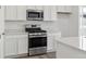 Sleek kitchen with stainless steel appliances, white cabinets and light countertops at 24769 E 39Th Ave, Aurora, CO 80019