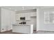 Modern kitchen with white cabinets, stainless steel appliances and a center island at 24769 E 39Th Ave, Aurora, CO 80019