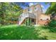 Beautiful, expansive backyard with a deck, hot tub, and play area at 1762 Red Fox Pl, Highlands Ranch, CO 80126