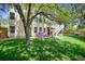 Backyard with tree, grass, and play area at 1762 Red Fox Pl, Highlands Ranch, CO 80126