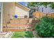 Backyard with stone steps and retaining walls leading to upper levels at 1762 Red Fox Pl, Highlands Ranch, CO 80126