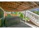 Backyard patio area with a covered hot tub and stairs leading to yard at 1762 Red Fox Pl, Highlands Ranch, CO 80126