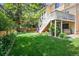 A spacious backyard offers a deck, lush lawn, and a relaxing hot tub for outdoor enjoyment at 1762 Red Fox Pl, Highlands Ranch, CO 80126