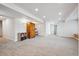 Finished basement with neutral carpet, closet, and wooden storage cabinet at 1762 Red Fox Pl, Highlands Ranch, CO 80126
