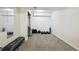 Basement workout area with carpet, mirrors, bench and free weights at 1762 Red Fox Pl, Highlands Ranch, CO 80126