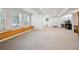 Finished basement features neutral carpet, built-in bench, bright windows, and ' play area at 1762 Red Fox Pl, Highlands Ranch, CO 80126