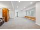 Finished basement area with neutral carpet, built-in bench seating, and lots of storage at 1762 Red Fox Pl, Highlands Ranch, CO 80126