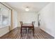 Formal dining room with wood flooring, a chandelier, and a large window at 1762 Red Fox Pl, Highlands Ranch, CO 80126