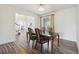 Formal dining room with wood flooring and a view of the home's foyer at 1762 Red Fox Pl, Highlands Ranch, CO 80126