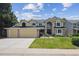 Inviting two-story home with a well-manicured lawn and attached three-car garage at 1762 Red Fox Pl, Highlands Ranch, CO 80126