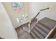Bright two-story foyer features stairs, large window and stylish front door with glass insert at 1762 Red Fox Pl, Highlands Ranch, CO 80126