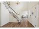 Inviting foyer with wood flooring and a staircase leading to the upper level at 1762 Red Fox Pl, Highlands Ranch, CO 80126
