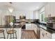 Well-appointed kitchen boasting granite countertops, stainless steel appliances, and modern finishes at 1762 Red Fox Pl, Highlands Ranch, CO 80126
