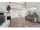 Spacious living room with a cozy fireplace and open floor plan offers ideal space for relaxation at 1762 Red Fox Pl, Highlands Ranch, CO 80126