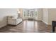 Cozy living room with a bay window and wood flooring throughout at 1762 Red Fox Pl, Highlands Ranch, CO 80126