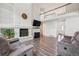 Inviting living room showcasing a fireplace and loft area, creating an open and airy atmosphere at 1762 Red Fox Pl, Highlands Ranch, CO 80126