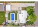 Aerial view of property showcasing pool, patio, garage, and well-manicured landscaping at 2981 Teller St, Wheat Ridge, CO 80033