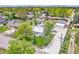Aerial view of a property showcasing a well-maintained home, lush greenery, pool, and convenient driveway at 2981 Teller St, Wheat Ridge, CO 80033