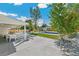 Backyard oasis featuring a swimming pool, covered patio, and dining area surrounded by lush landscaping at 2981 Teller St, Wheat Ridge, CO 80033