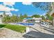 Spacious backyard featuring a sparkling pool, lush lawn, and stylish lounging areas, ideal for outdoor living at 2981 Teller St, Wheat Ridge, CO 80033