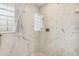 Modern bathroom showcasing marble tiling in the shower with complementary hexagon shower floor tiles at 2981 Teller St, Wheat Ridge, CO 80033